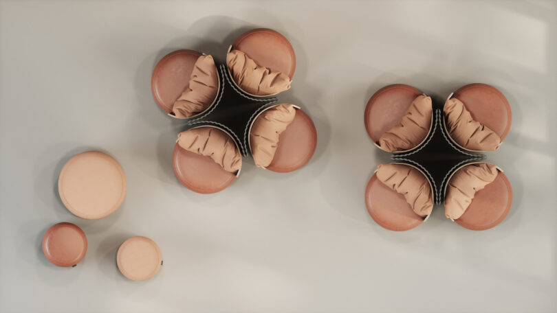 aerial view of Contemporary seating arrangements with leather chairs, pillows, and privacy partitions. Multiple ottomans in varying sizes are arranged nearby