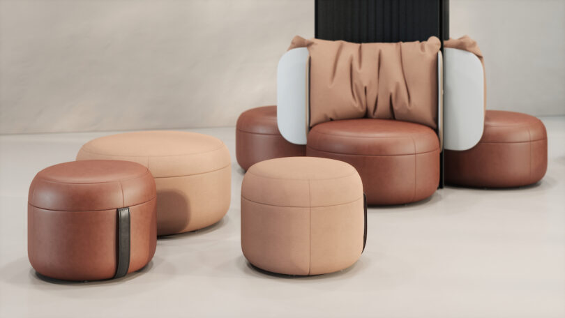 Contemporary seating arrangement with rounded beige and brown ottomans and a chair featuring a cushioned backrest