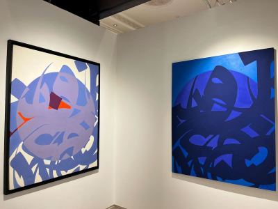Two abstract paintings resembling calligraphic forms against colorful backgrounds.