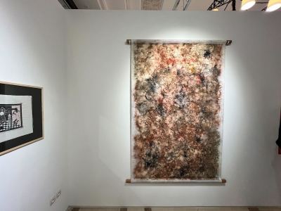 A hanging abstract painting.