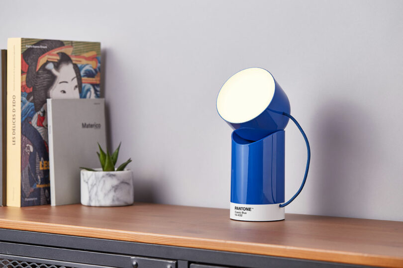 A blue modern lamp labeled 