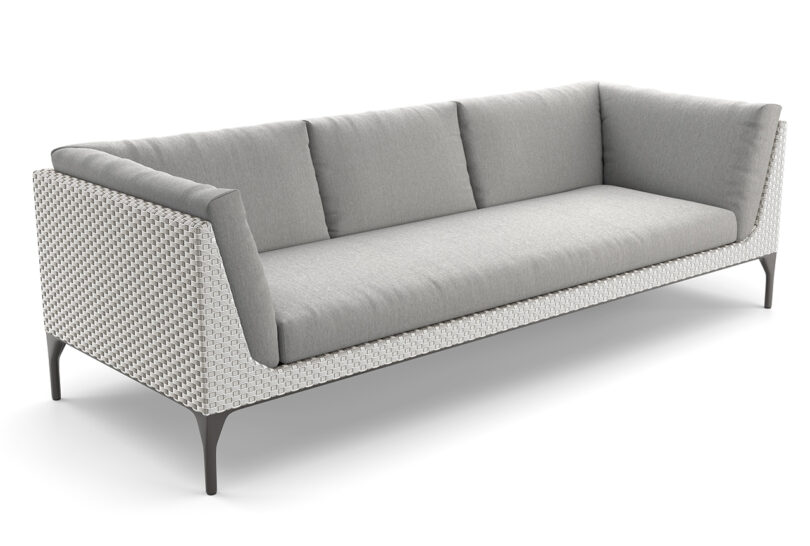 A modern grey fabric sofa with a textured, patterned frame and slender black legs. The sofa has three back cushions and a clean, minimalist design.