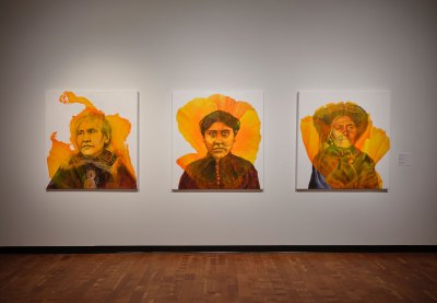Three portraits of Indigenous women with yellow flowers painted over them. 