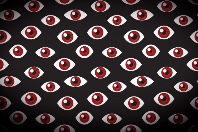 1740102066_Stalkerware-apps-Cocospy-and-Spyic-are-exposing-phone-data-of.jpg a series of floating eyes on a darkened background