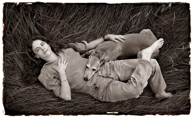 Civil-Liberty-Organizations-Demand-Police-Return-Sally-Mann-Photos.jpg Photographer Sally Mann relaxes with her dog Honey in a meadow of tall grass on her farm near Lexington, Virginia.
