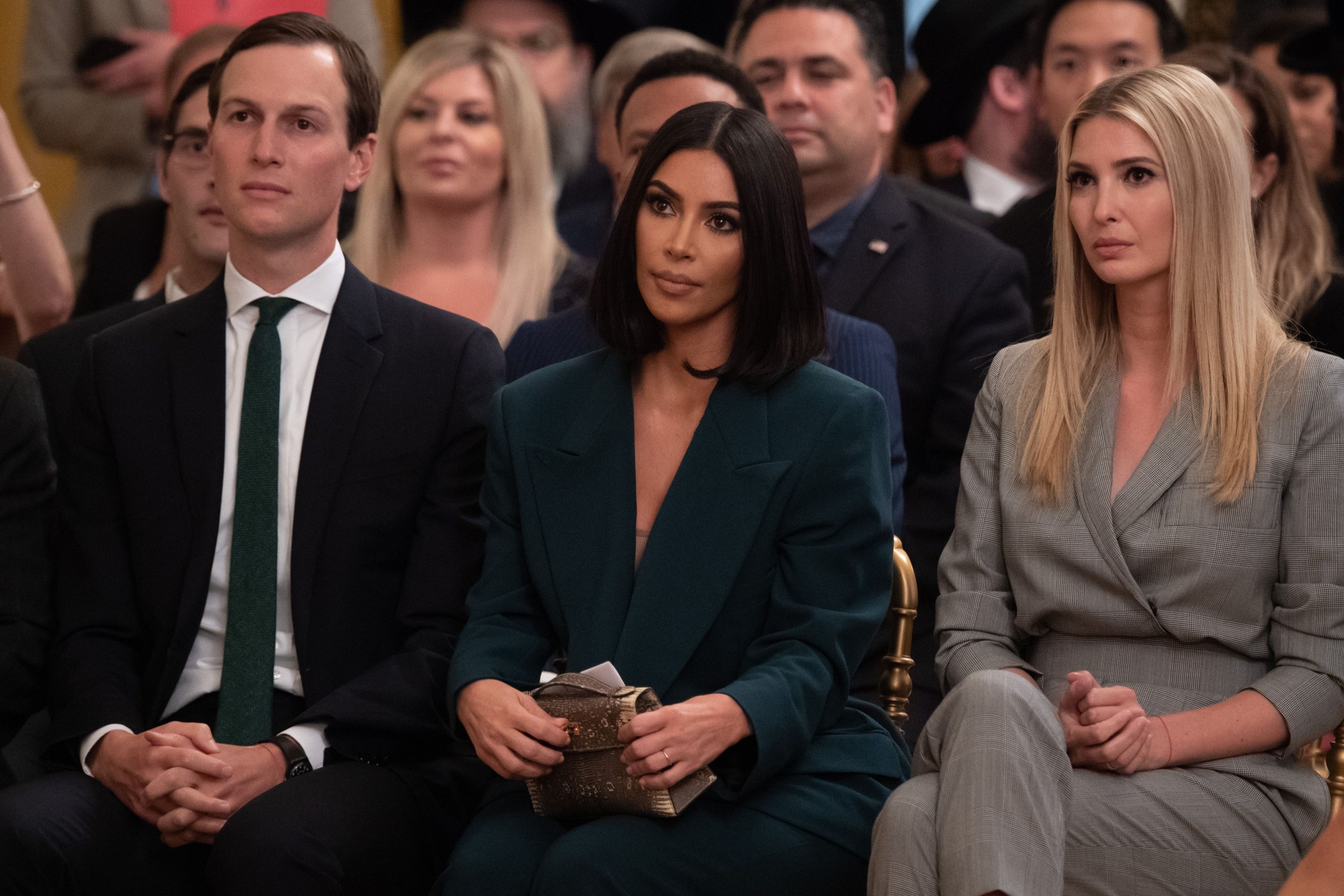 Kim Kardashian, Ivanka Trump, and Jared Kushner sitting in a row