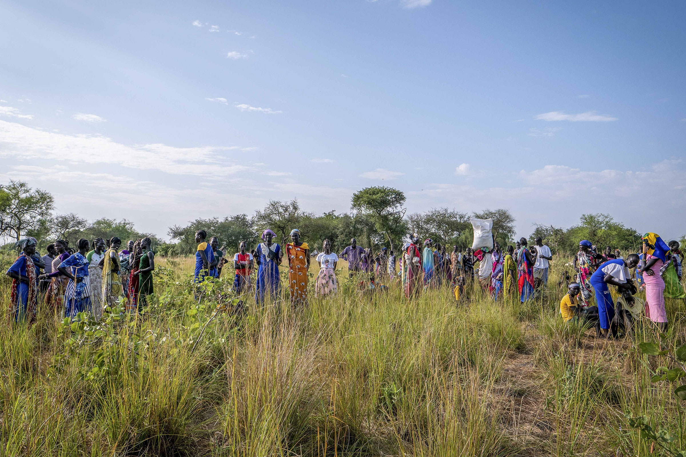 How-Trumps-Foreign-Aid-Freeze-Is-Shaking-the-Whole-System.jpg People wait for food rations at a World Food Programme distribution point organized by Catholic Relief Services in Jonglei state, South Sudan, Nov. 13, 2024.