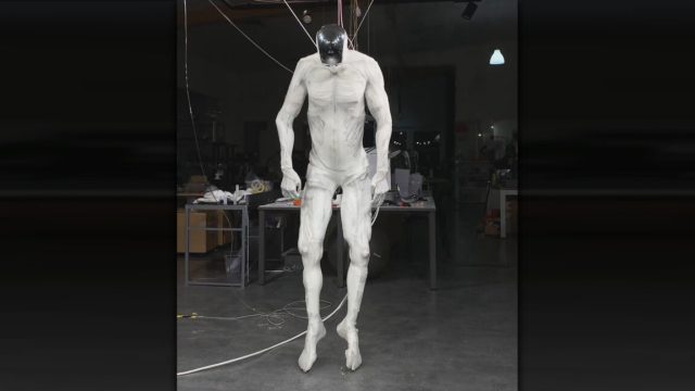 Robot-with-1000-muscles-twitches-like-human-while-dangling-from.jpg A still frame from a Clone Robotics Protoclone robot demo.