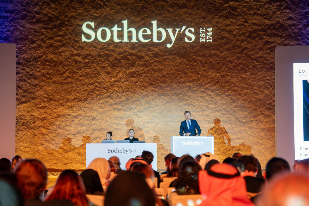 Sothebys-Hosts-Saudi-Arabias-First-Ever-International-Auction.jpg A crowd in front of a man on a rostrum.