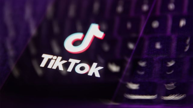 TikTok-sunsets-its-creator-marketplace-for-TikTok-One-a-broader.jpg A laptop keyboard and TikTok logo displayed on a phone screen are seen in this multiple exposure illustration.