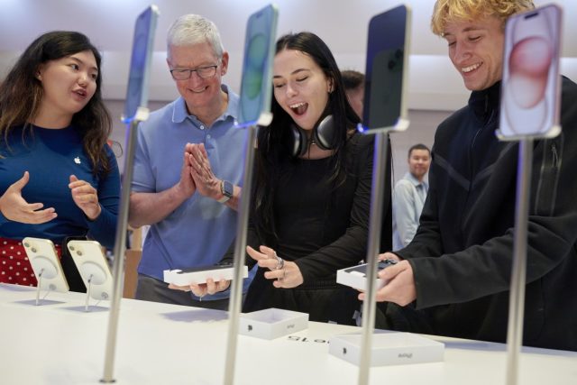 Tim-Cook-teases-Apple-product-news-for-February-19.jpg Tim Cook, chief executive officer of Apple Inc., second left, at the company's Fifth Avenue store in New York