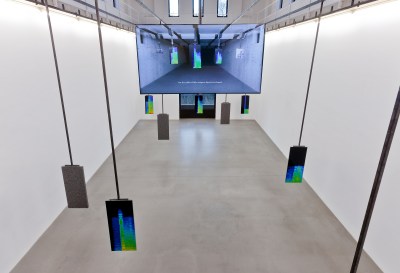 A screen hanging above diagrams of sounds. The screen also displays those diagrams.
