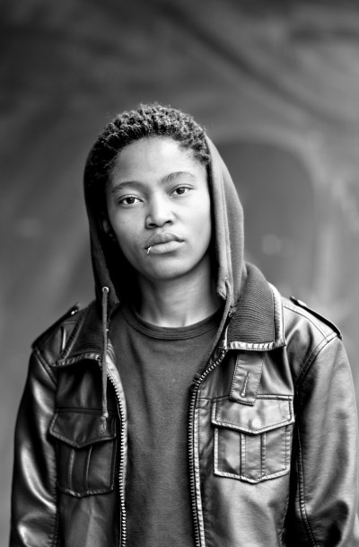 A photograph of a person wearing a hoodie.