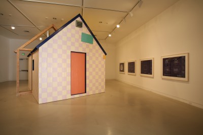 A model house built inside an art gallery.