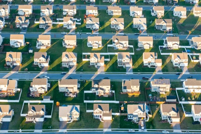 1742229364_Palmetto-wants-software-developers-to-electrify-America-using-its-AI.jpg Aerial view of rows of suburban tract houses
