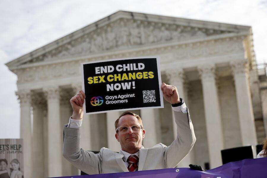 A transgender rights opponent rallies outside of the U.S. Supreme Court as the justices hear arguments in a case on transgender health rights on December 04, 2024 in Washington, DC. The Supreme Court is hearing arguments in US v. Skrmetti, a case about Tennessee's law banning gender-affirming care for minors and if it violates the Constitution’s equal protection guarantee. (Photo by Kevin Dietsch/Getty Images)