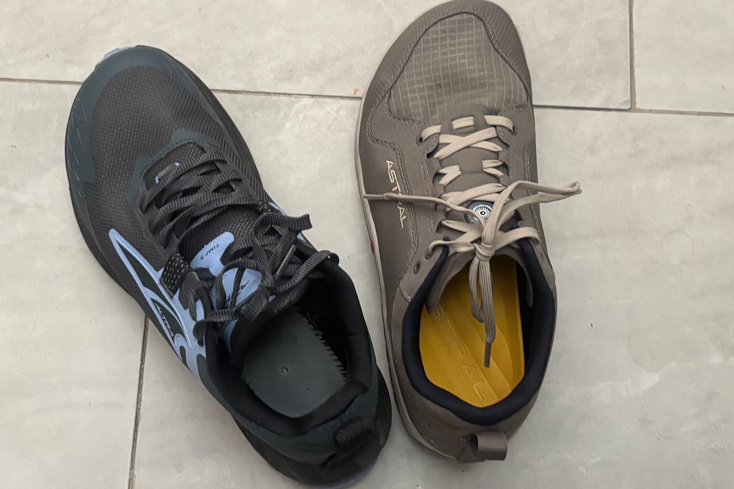 A top-down view of two hiking shoes side by side, one Astral NoSobo and one Altra