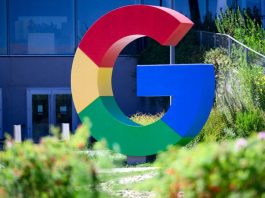 A large Google logo in the shape of a multi-colored G is seen outside Google's Mountain View offices.