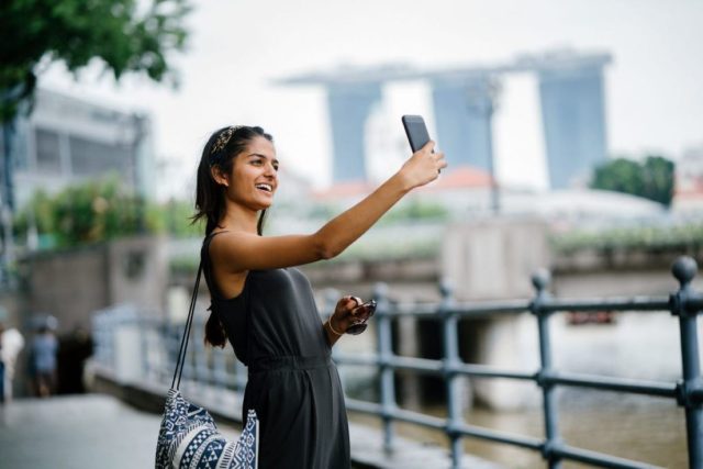 How-Countries-Are-Competing-for-Indias-Next-Million-Tourists.jpg An Indian tourist in Singapore.