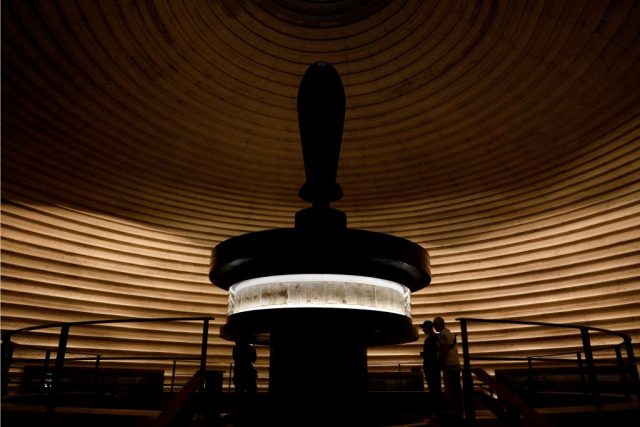 Israel-Museum-General-Manager-Resigns-After-Less-than-Two-Years.jpg TOPSHOT - Men look at the Dead Sea Scrolls found in Qumran caves in the Judean Desert and dated around 120 BC, during a visit to the Shrine of the Book at at the Israel Museum on May 2, 2018 in Jerusalem. - The Dead Sea Scrolls are a collection of hundreds of biblical texts in Hebrew, Aramaic, and Greek discovered 45 years ago in the Qumran Caves near the Dead Sea. (Photo by GALI TIBBON / AFP) (Photo by GALI TIBBON/AFP via Getty Images)
