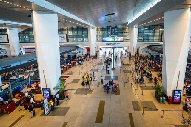 New-Experiences-Driving-Growth-in-India-Travel-Sector.jpg Travelers at the Delhi international airport.