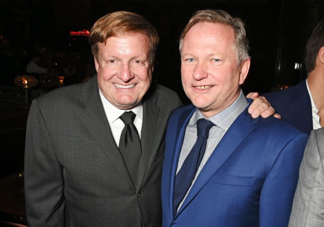 Securities-Law-Firm-Announces-Investigation-of-Soho-House.jpg Two men in suits smile for the camera.