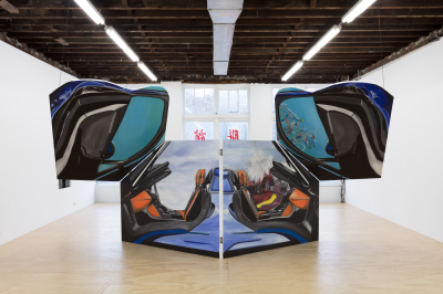 A shaped painting resembling a car with opened doors.
