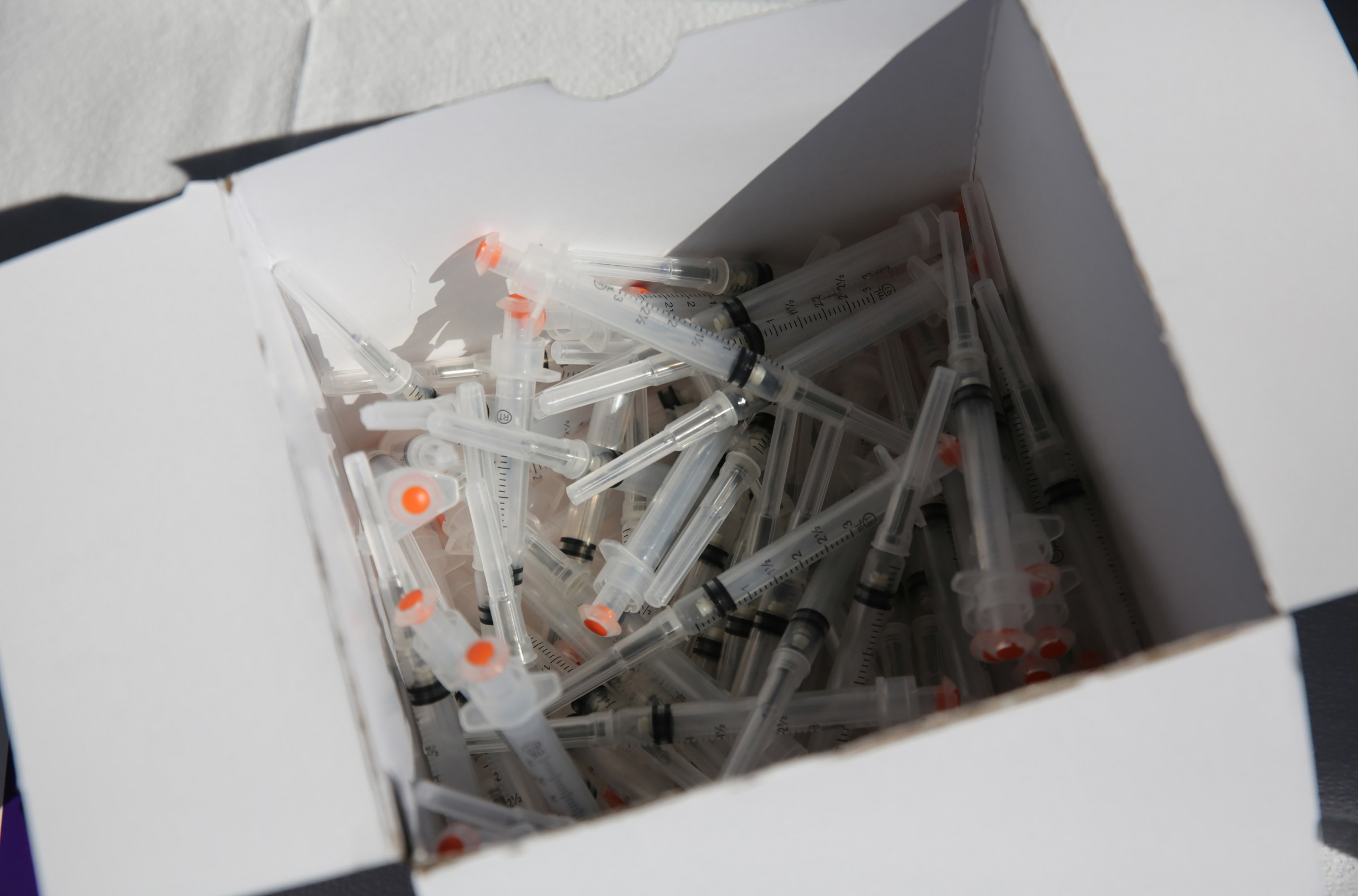 Syringes in a box during a drive-thru flu shot clinic at the Louisiana State Fairgrounds in Shreveport, Louisiana, on November 5, 2020.