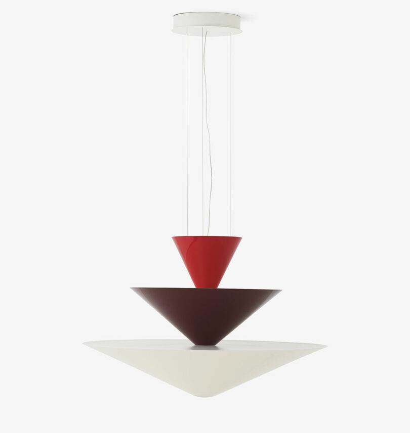 Modern pendant light with three stacked, inverted cone shapes in red, brown, and white.
