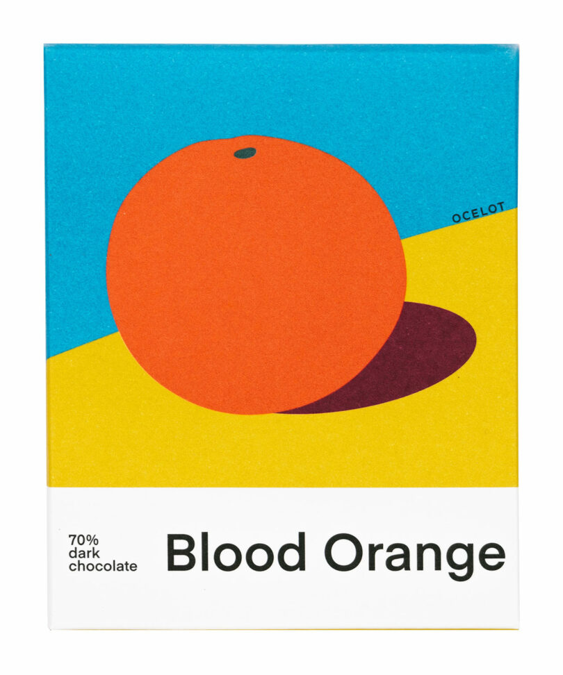 Bright, abstract art of an orange with a shadow on a colorful box labeled