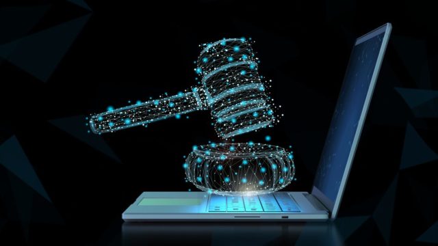 AI-secretly-helped-write-California-bar-exam-sparking-uproar.jpg A computer-generated gavel hovering over a laptop.