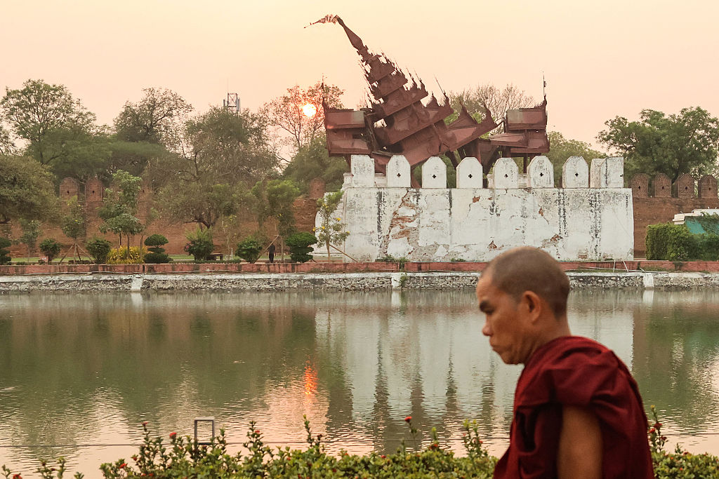 An-Earthquake-Damages-Cultural-Heritage-Sites-in-Myanmar-and-Thailand.jpg A Buddhist monk walks past the damaged Mandalay Palace after the deadly 2025 Myanmar earthquake.