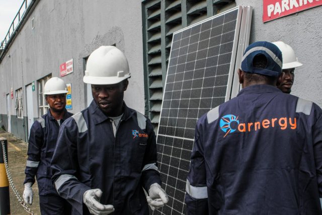 Bill-Gates-backed-Arnergy-to-expand-solar-access-in-Nigeria-with.jpeg Arnergy crew with solar panels