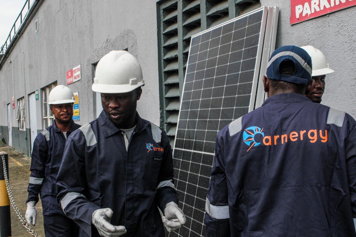 Arnergy crew with solar panels