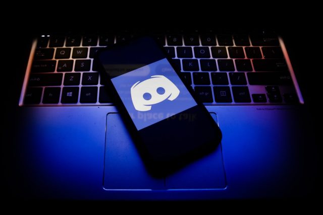 Discord-appoints-former-Activision-Blizzard-exec-Humam-Sakhnini-as-CEO.jpg Discord logo displayed on a phone screen and a keyboard.