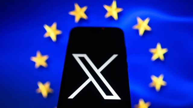 EU-may-make-an-example-of-X-by-issuing-1.jpg In this photo illustration an X logo is displayed on a smartphone with the European Union flag in the background.