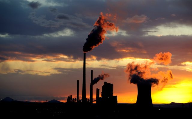 PHNX-Materials-found-a-way-to-decarbonize-concrete-using-dirty.jpg Coal power station with smoking chimneys at sunset against a cloudy sky.