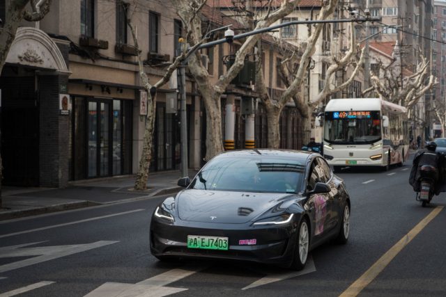 Tesla-begins-FSD-Supervised-ride-hail-tests-with-employees-in-Austin.jpg Tesla Model 3 vehicle drives on the street on February 27, 2025 in Shanghai, China.