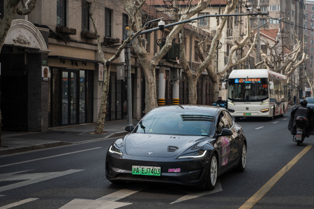 Tesla-begins-FSD-Supervised-ride-hail-tests-with-employees-in-Austin.jpg Tesla Model 3 vehicle drives on the street on February 27, 2025 in Shanghai, China.