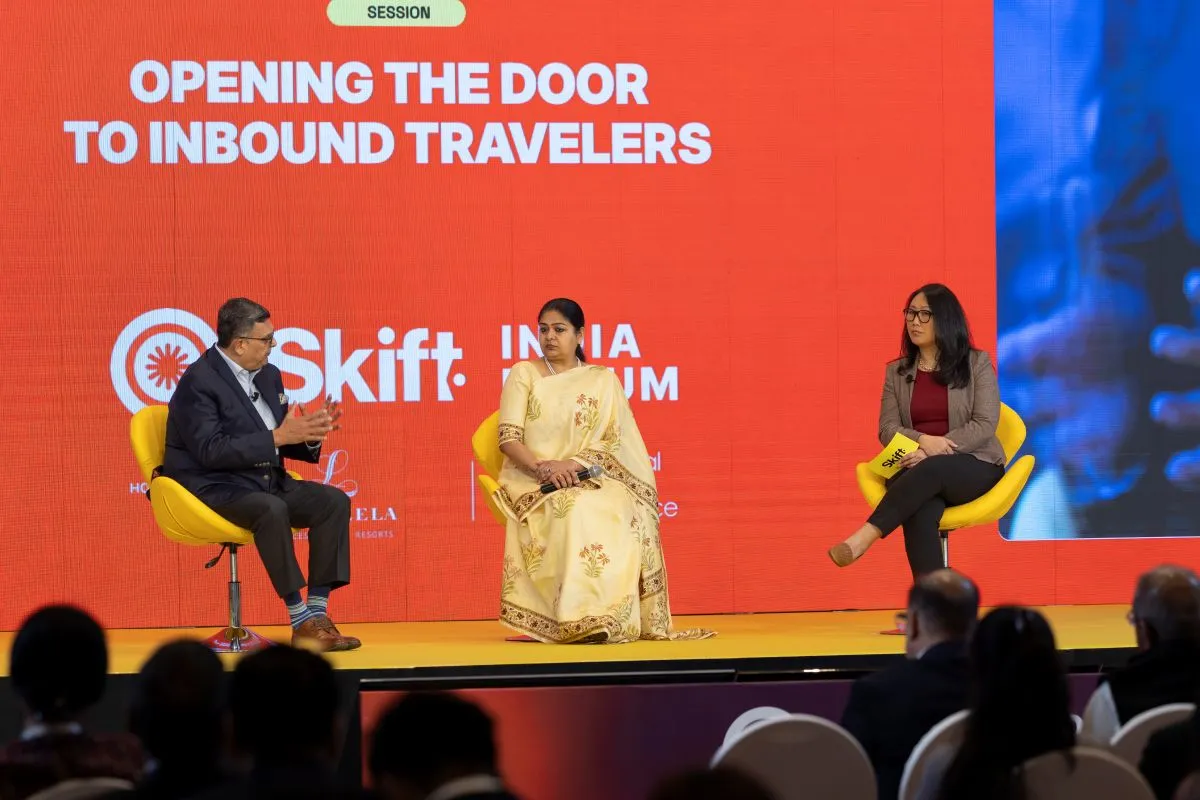 What-the-Travel-Industry-Wants-Now.jpg Dipak Deva, Managing Director and CEO of Travel Corporation India (Left) and Mugdha Sinha, Director General of Tourism, Government of India, with Skift Asia Editor Peden Bhutia at Skift India Forum 2025.