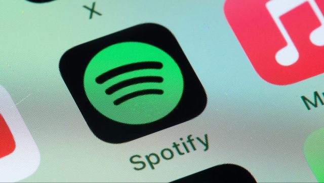 1747903684_Spotifys-new-Upcoming-Releases-hub-highlights-future-albums-you-may.jpg Spotify, Apple Music on smart phone screen.