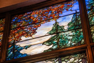 View of the top of the stained glass window showing fall foilage. 