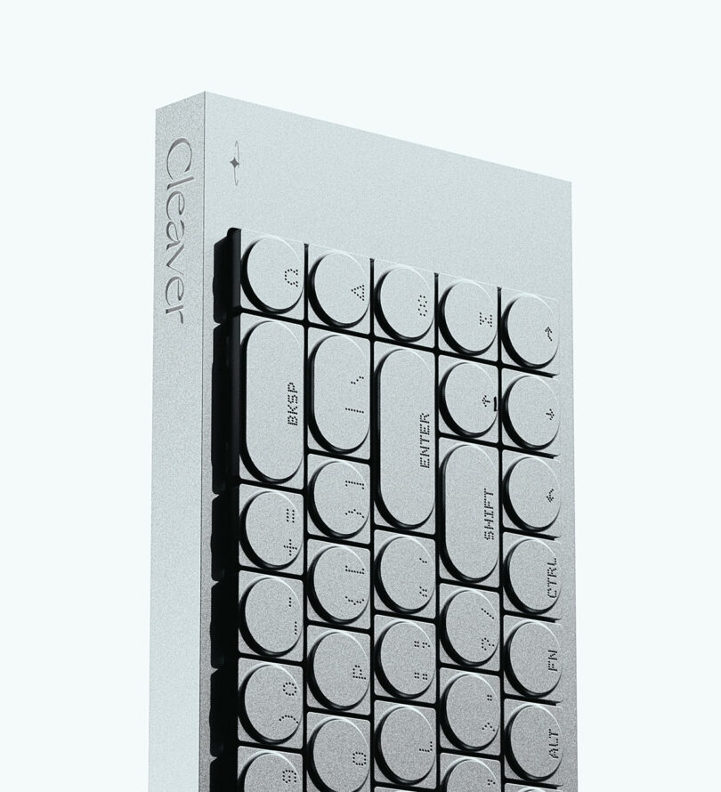 A minimalist keyboard with round keys and braille labels, featuring BKSP, ENTER, SHIFT, ALT, FN, and the word 