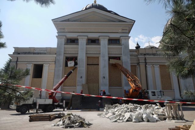 Art-Experts-Demand-Russia-Ejected-from-ICOM-for-Ethics-Violations.jpg TOPSHOT - Cranes and workers board up the windows of the Transfiguration Cathedral damaged as a result of a missile strike in Odesa on July 23, prior to a service on July 24, 2023, amid the Russian invasion of Ukraine. Ukraine on Sunday said 19 people, including four children, were wounded in a Russian overnight missile attack on Odesa that also killed one person. (Photo by Oleksandr GIMANOV / AFP) (Photo by OLEKSANDR GIMANOV/AFP via Getty Images)