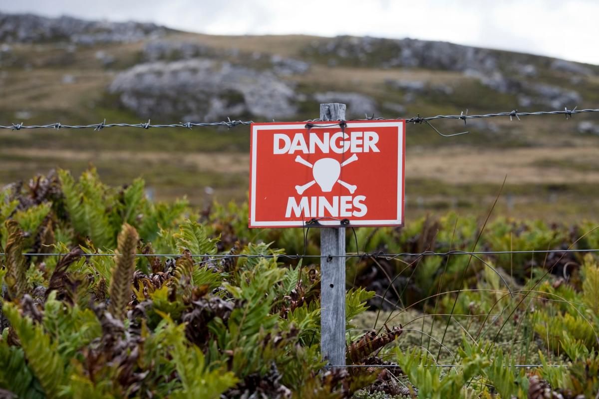 Fieldstone-Bio-is-building-microbes-that-can-sense-everything-from.jpeg A sign warns people of landmines.