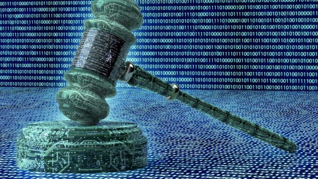 Jury-orders-NSO-to-pay-167-million-for-hacking-WhatsApp.jpg Illustration of a judge's gavel on a digital background resembling a computer circuit board.