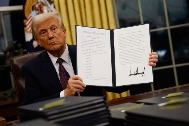 Legal-Injunction-Pauses-Cuts-in-IMLS-Funding.jpg WASHINGTON, DC - JANUARY 20: President Donald Trump signs executive orders in the Oval Office on January 20, 2025 in Washington, DC. Trump takes office for his second term as the 47th president of the United States. (Photo by Anna Moneymaker/Getty Images)
