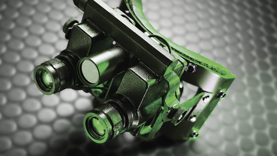 New-material-may-help-us-build-Predator-style-thermal-vision-specs.jpg Image of bulky night vision goggles made of black material, but lit with a green light.