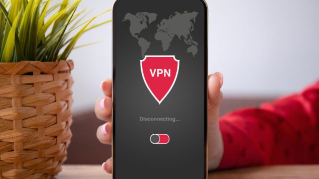 VPN-firm-says-it-didnt-know-customers-had-lifetime-subscriptions.jpg hand holding phone with VPN app that says "disconnected" on the screen