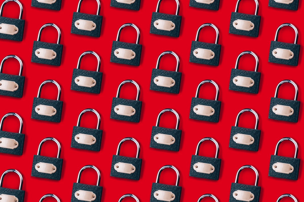 X-hits-pause-on-its-encrypted-DMs-feature.jpg a pattern of locks on a red background